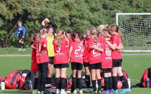 a group of girls in a football field