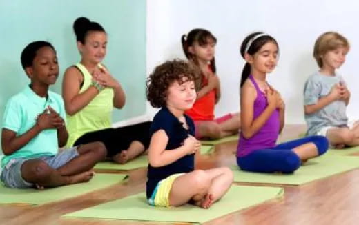 a group of children sitting on the floor