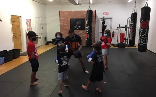 a group of kids playing in a gym