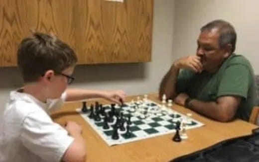 a couple of men playing chess