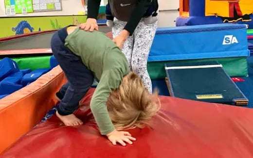 a person doing push ups on a mat