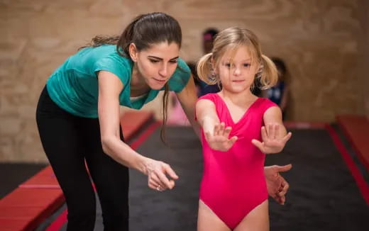 a woman and a girl dancing