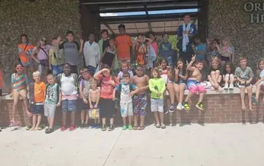 a group of children posing for a photo