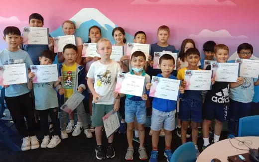 a group of children holding signs