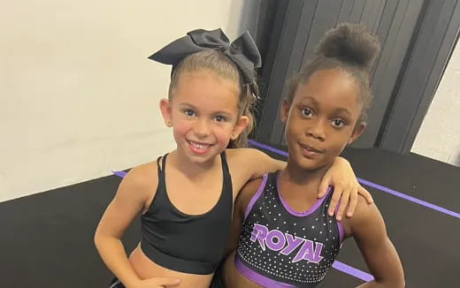 a couple of girls posing for the camera