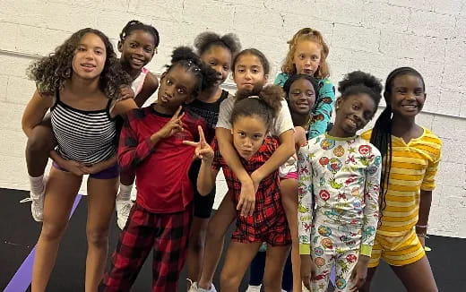 a group of girls posing for a photo