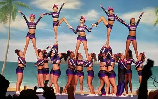 a group of women in swimsuits on a stage