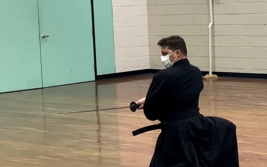 a person wearing a mask and holding a gun