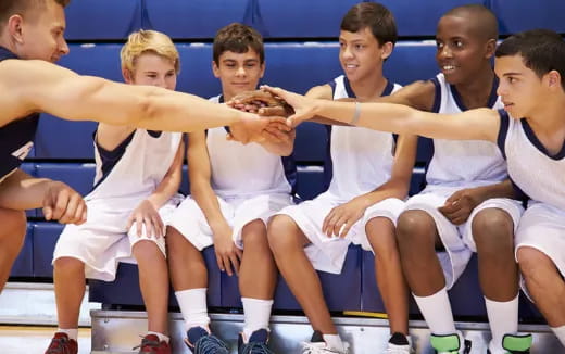a group of people in white uniforms