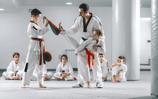 a group of people in karate uniforms