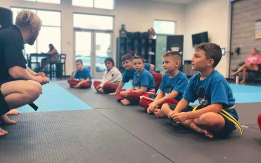 a group of children sitting on the floor