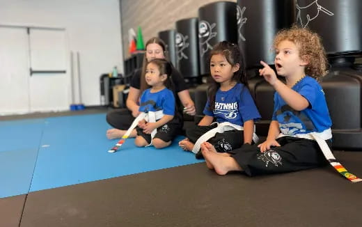 a group of kids sitting on the floor
