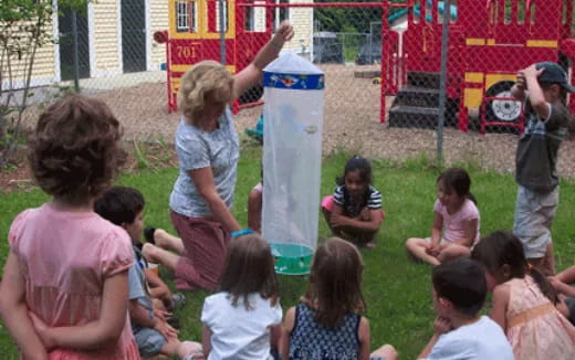 a group of children playing in a yard