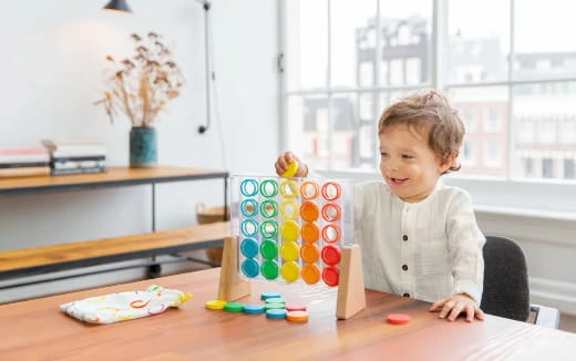 a child sitting at a table