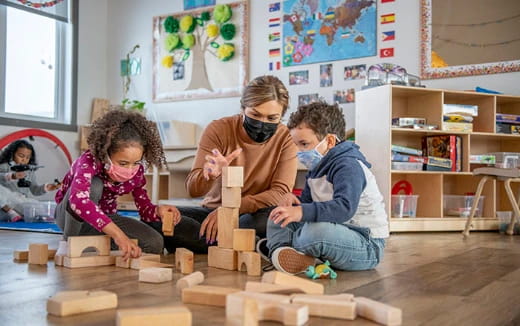 a group of children playing with blocks