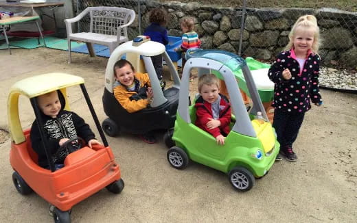 a group of children in strollers