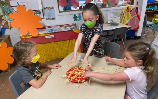 a group of children playing with toys