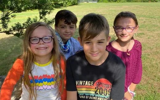 a group of children posing for a photo