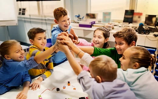 a group of children sitting on the floor