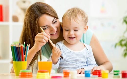 a person and a child painting