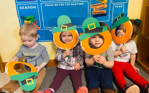 a group of kids wearing hats