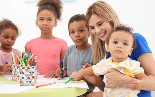 a group of children sitting at a table