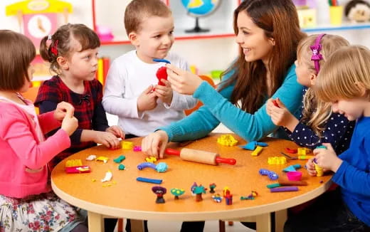 a group of children playing a board game