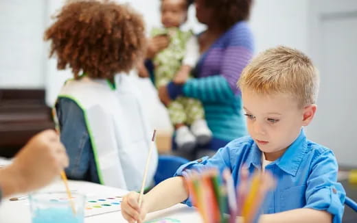 a child sitting at a table
