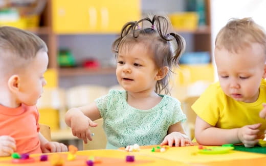 a group of children playing with toys