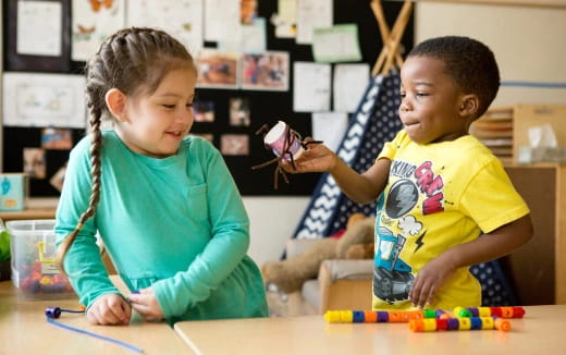 a couple of children playing with toys