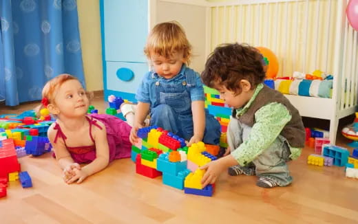 a group of children playing with toys