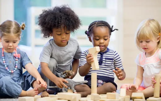 a group of children sitting on the floor