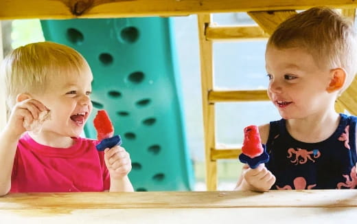 a couple of kids playing with toys