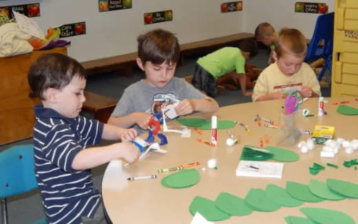 a group of children playing with toys