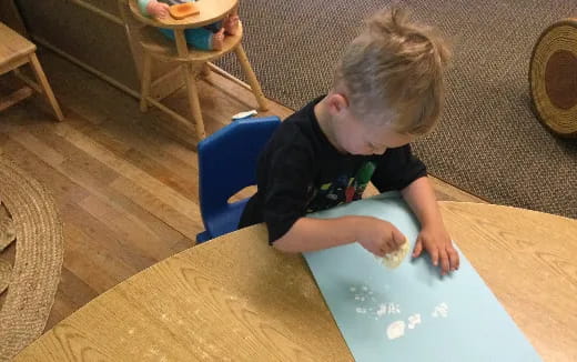 a child sitting at a table