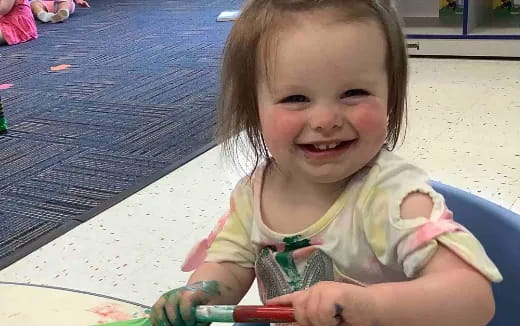 a child sitting on a table