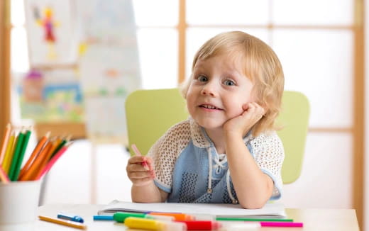 a child sitting at a table