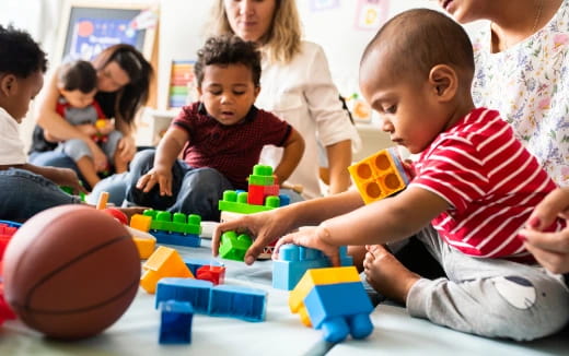 a group of children playing with toys