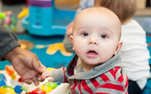a baby being held by a person