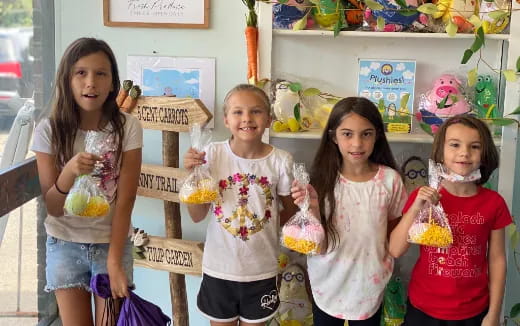 a group of girls holding flowers