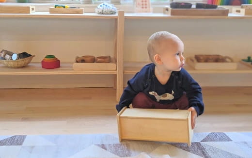a baby sitting in a box