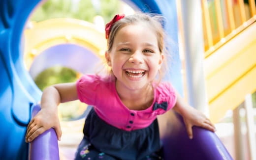 a girl smiling at the camera