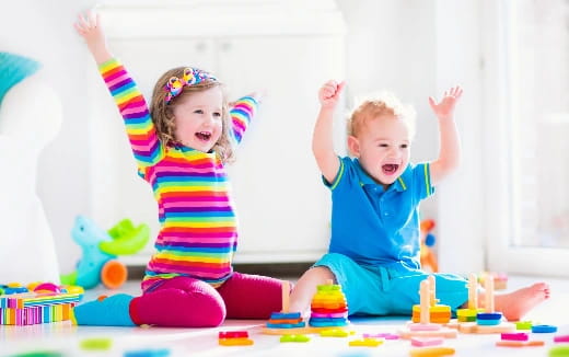 a couple of children playing with toys