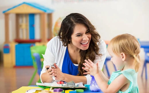 a person and a child playing with a toy