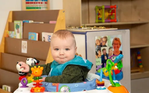 a baby sitting at a table