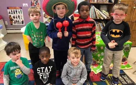 a group of children holding toys
