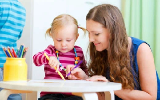 a person and a child painting