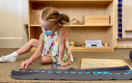 a little girl playing with a toy