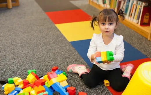 a child sitting on the floor