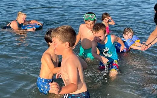 a group of children in the water